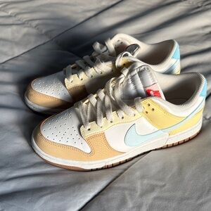 Nike White and Tan Sneakers with Yellow and Blue Accents: Women’s Size 7